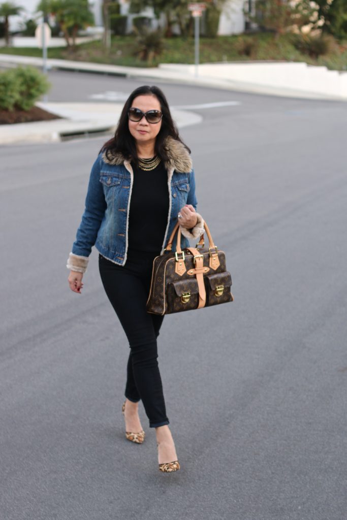 Image of a black on black outfit layered with a denim jacket